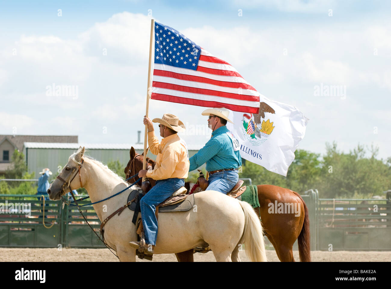 Men holding flags during opening ceremony at rodeo Stock Photo Alamy