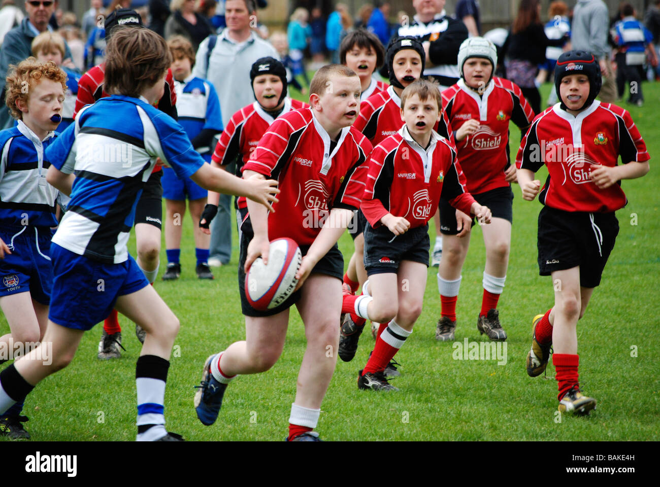young boys playing rugby Stock Photo
