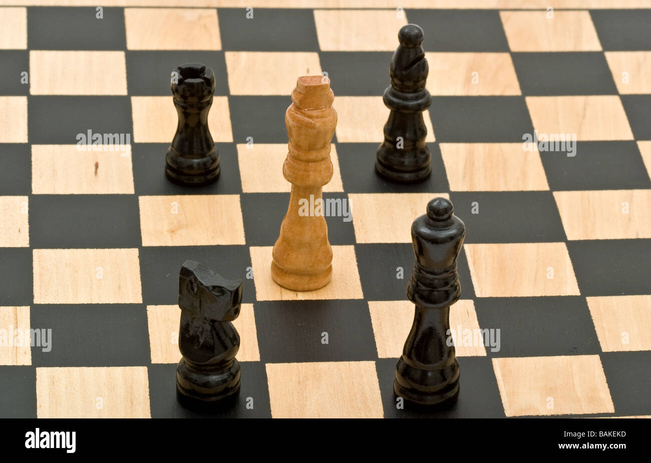 Chess Board With King Queen And Rook In Checkmate Stock Photo - Download  Image Now - iStock