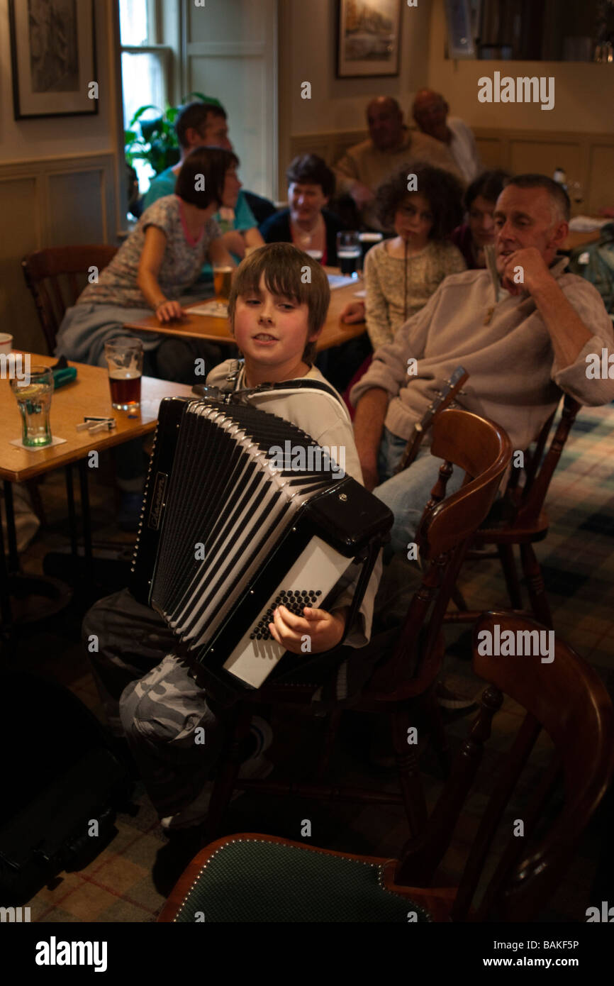 Folk music in the Scottish Borders young musicians teenage boy with accordion Stock Photo