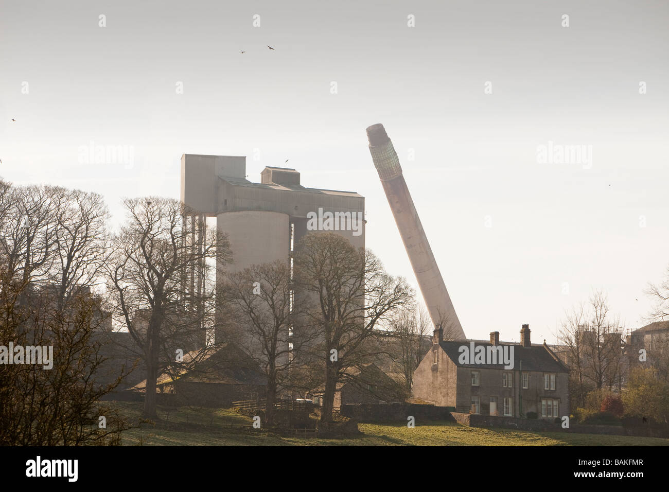 The old chimney at Castle Cement in Clitheroe Lancashire UK being demolished Stock Photo