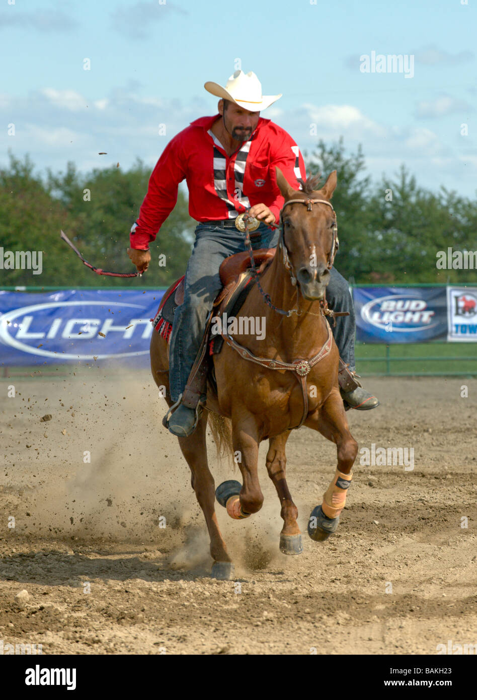 Man riding horse at rodeo Stock Photo