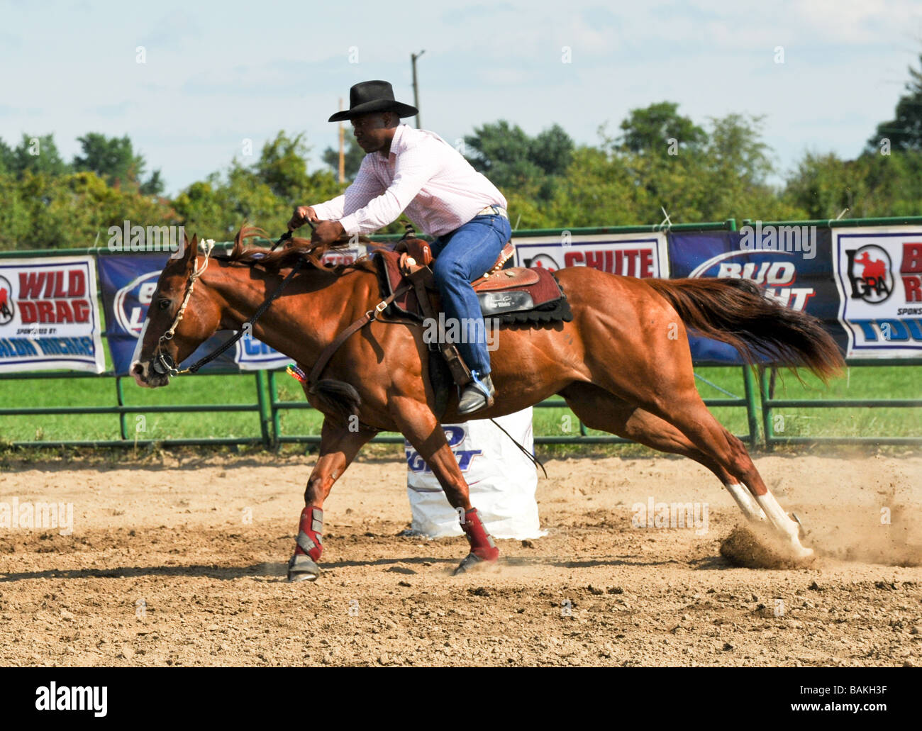 Horse running in barrel race at rodeo Stock Photo Alamy