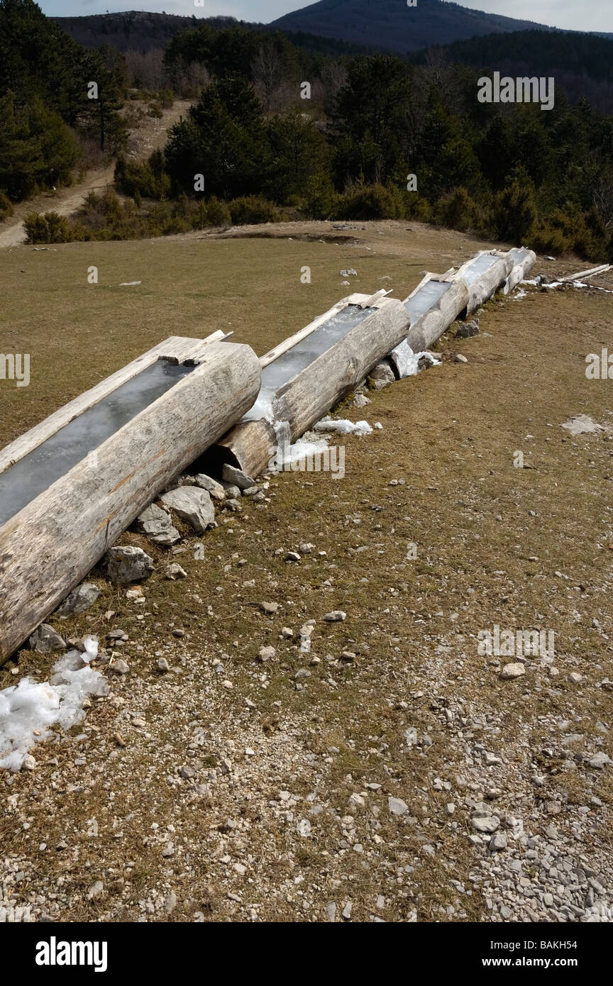 Troughs, watering place for livestock in mountains with frozen water