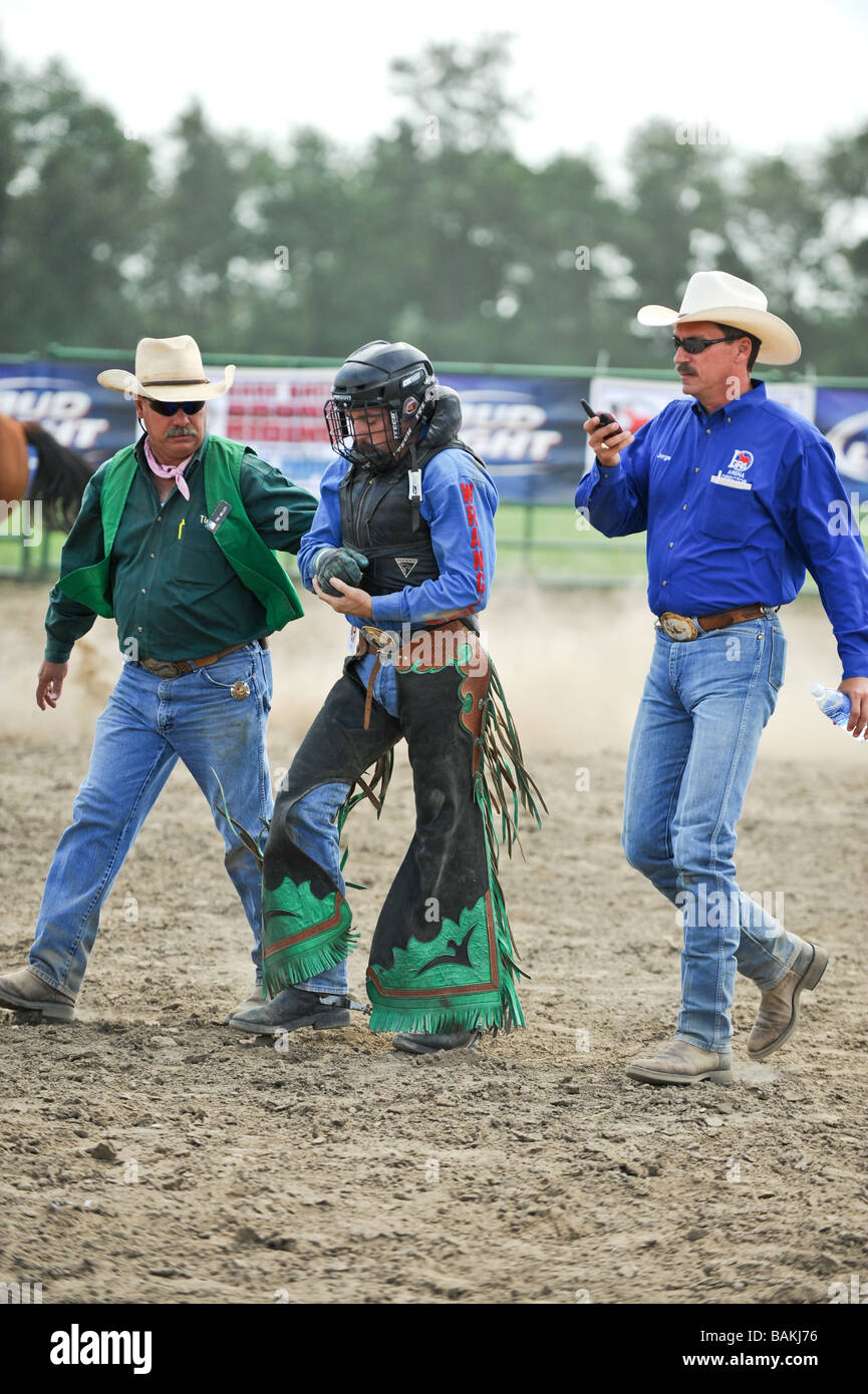 cowboy with broken arm injury at rodeo Stock Photo