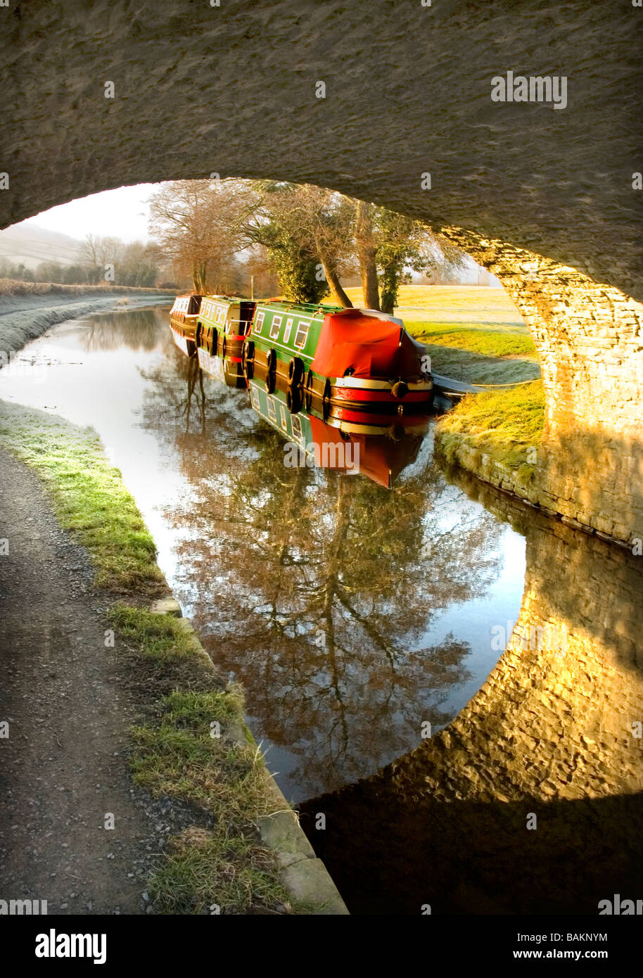 Brecon and Monmouth  canal looking under bridge with narrow boat Stock Photo
