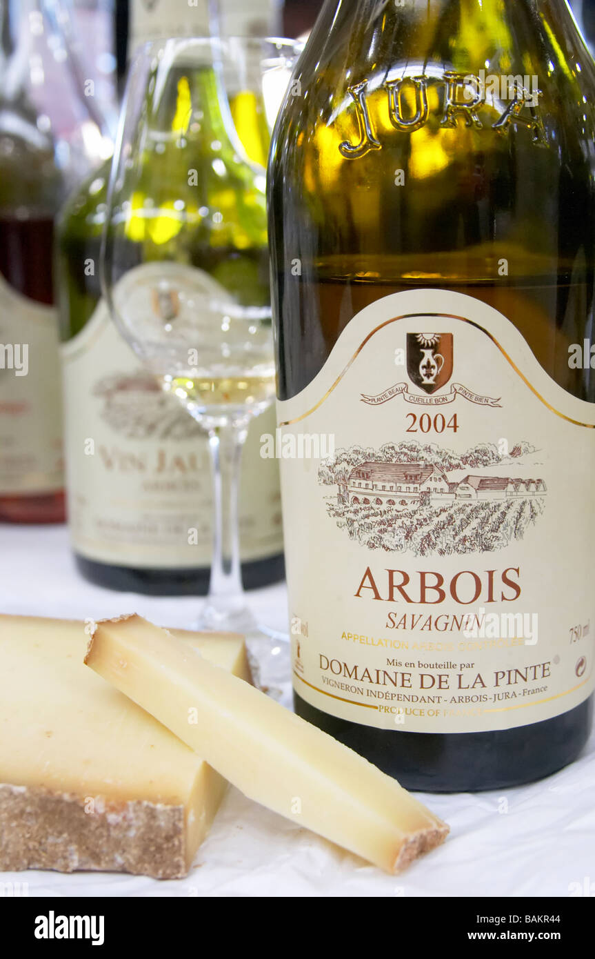 bottle with moulded relief on neck glass of arbois savagnin comte cheese domaine de la pinte arbois france Stock Photo