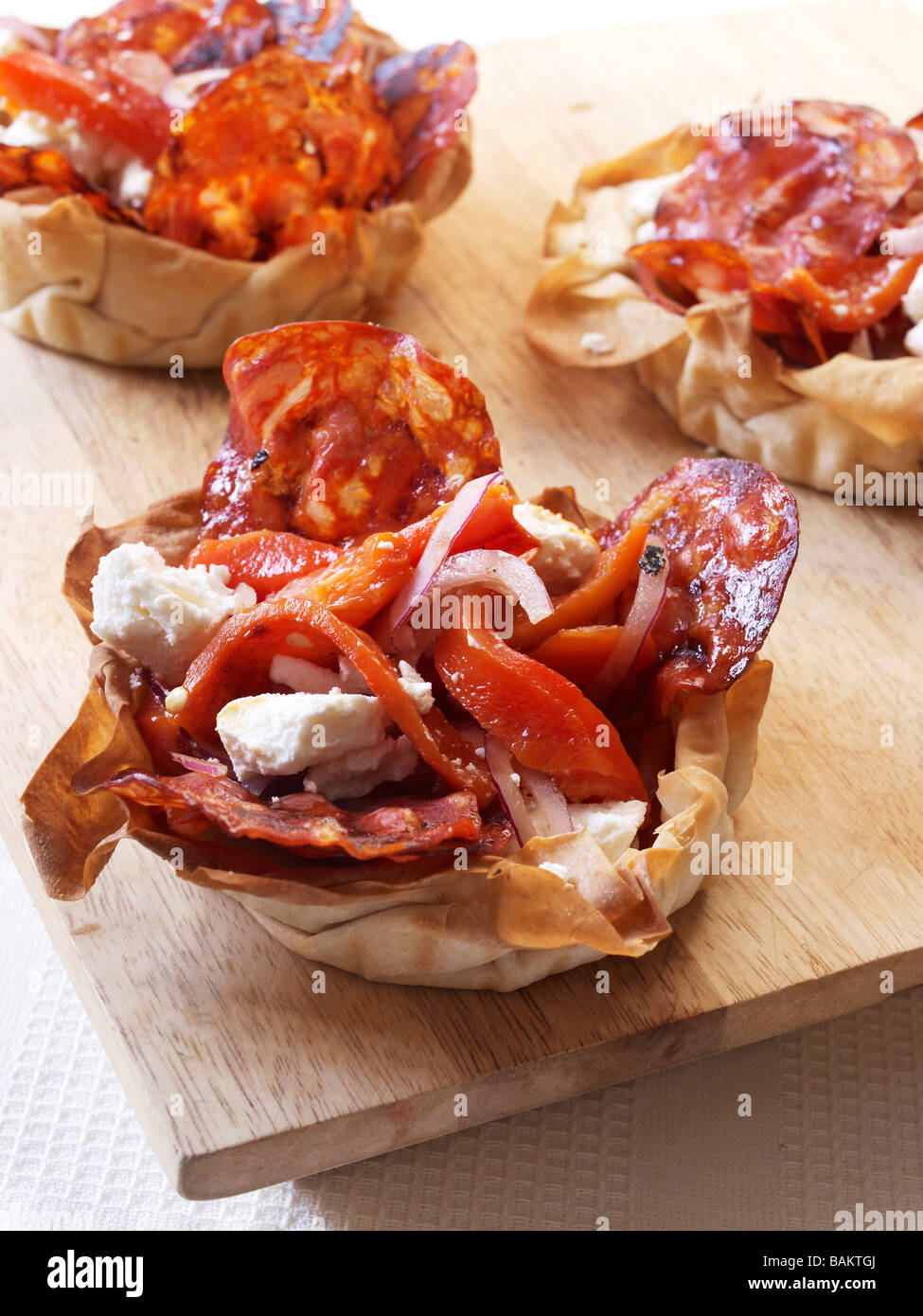 Filo pastry filled with Goats Cheese, Chorizo and Red Peppers Stock Photo