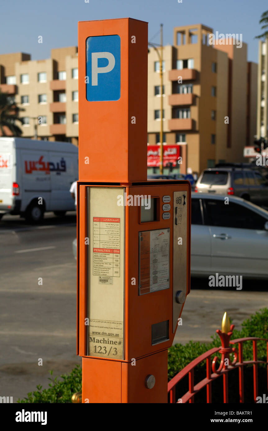 Parking meters are increasingly common in Dubai (and soon in Abu Dhabi) and inspectors are regular visitors to metered car parks Stock Photo