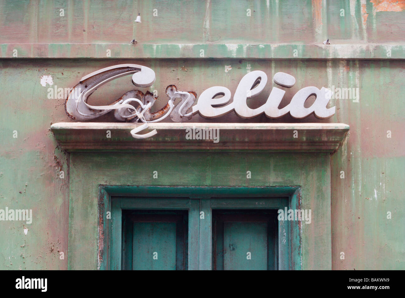 Broken neon sign on derelict building in Spain Stock Photo