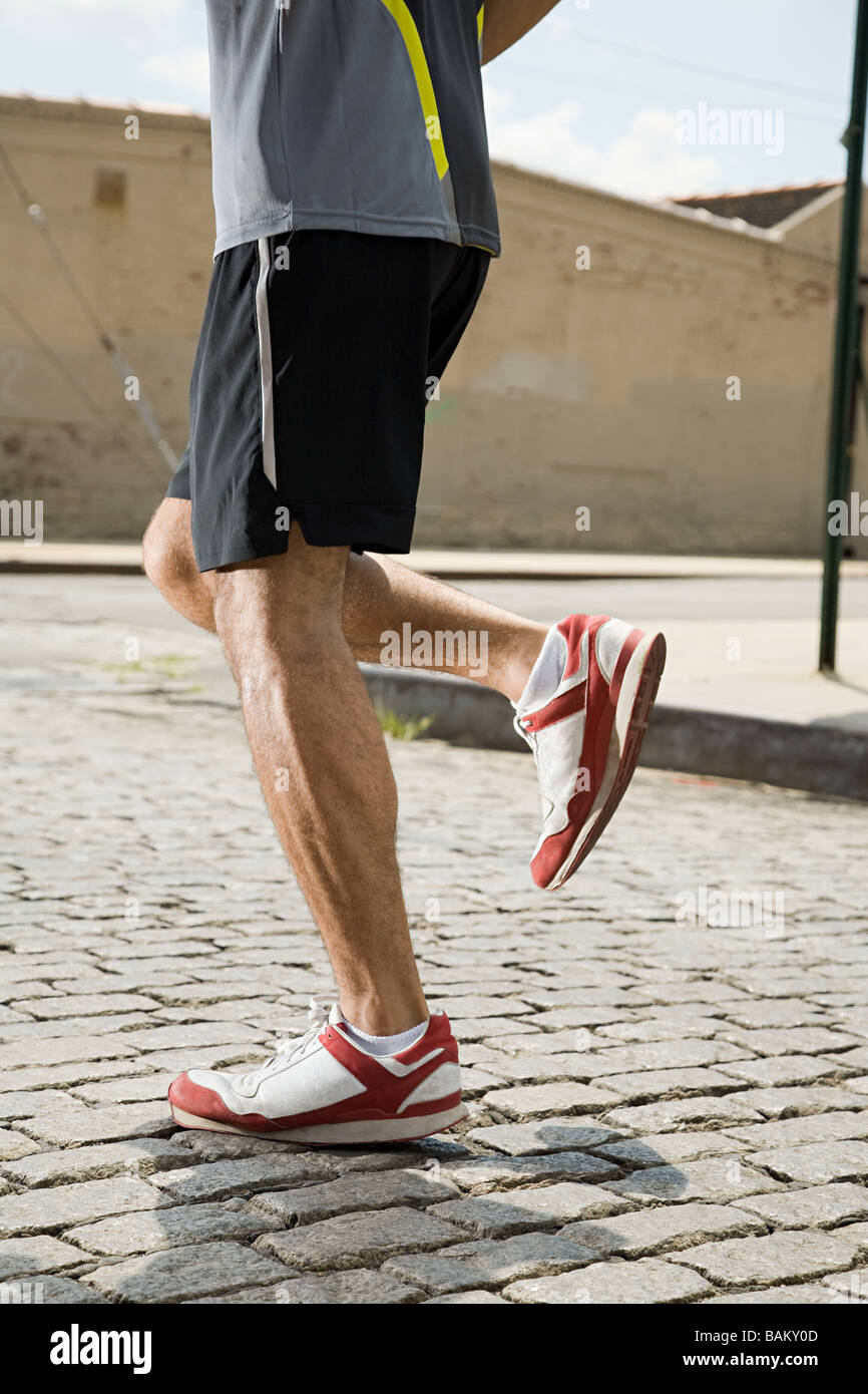 Legs of a runner Stock Photo