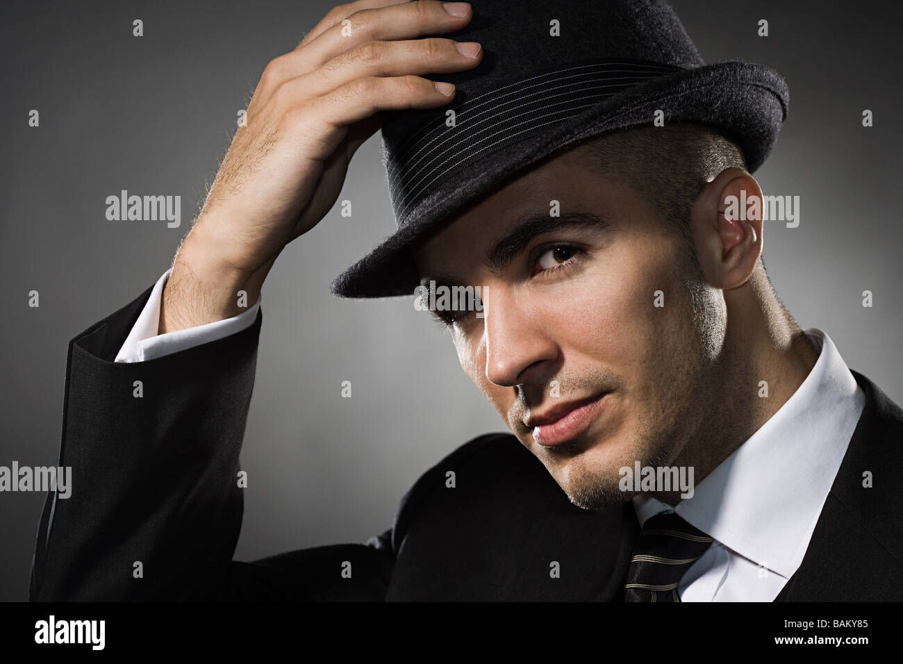 Portrait of a young man wearing a fedora Stock Photo