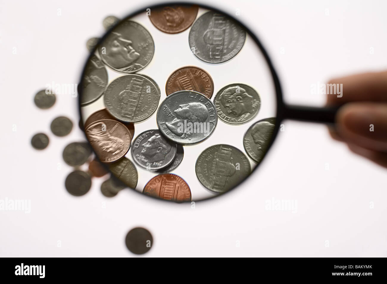 Close up coins magnifying glass hi-res stock photography and