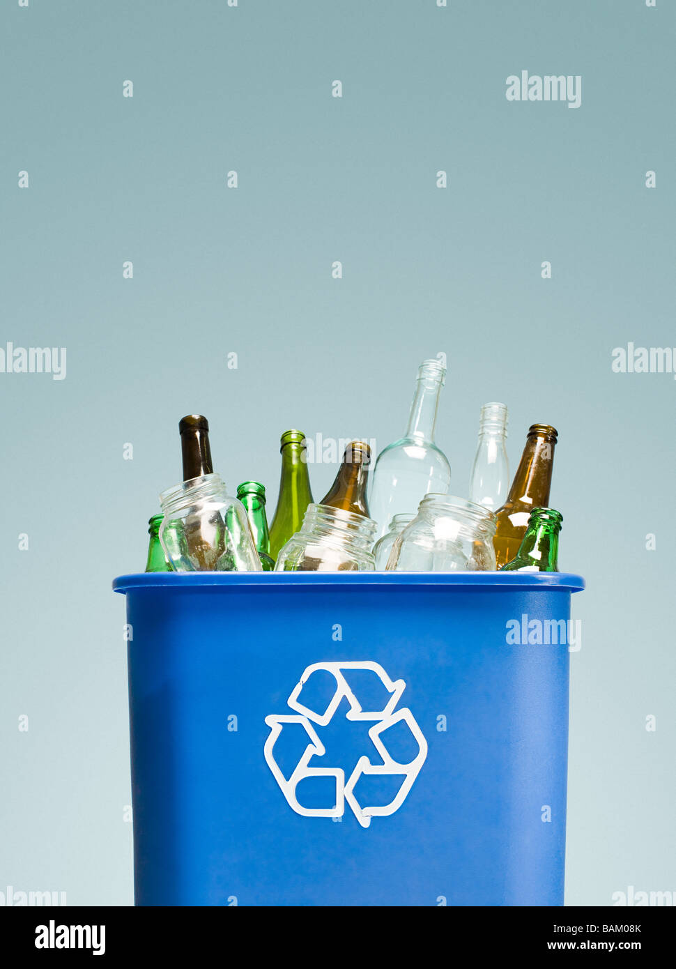 Glass bottles in a recycling bin Stock Photo Alamy