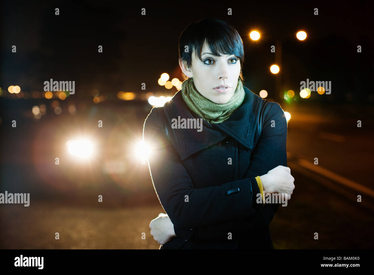 Woman on road at night Stock Photo
