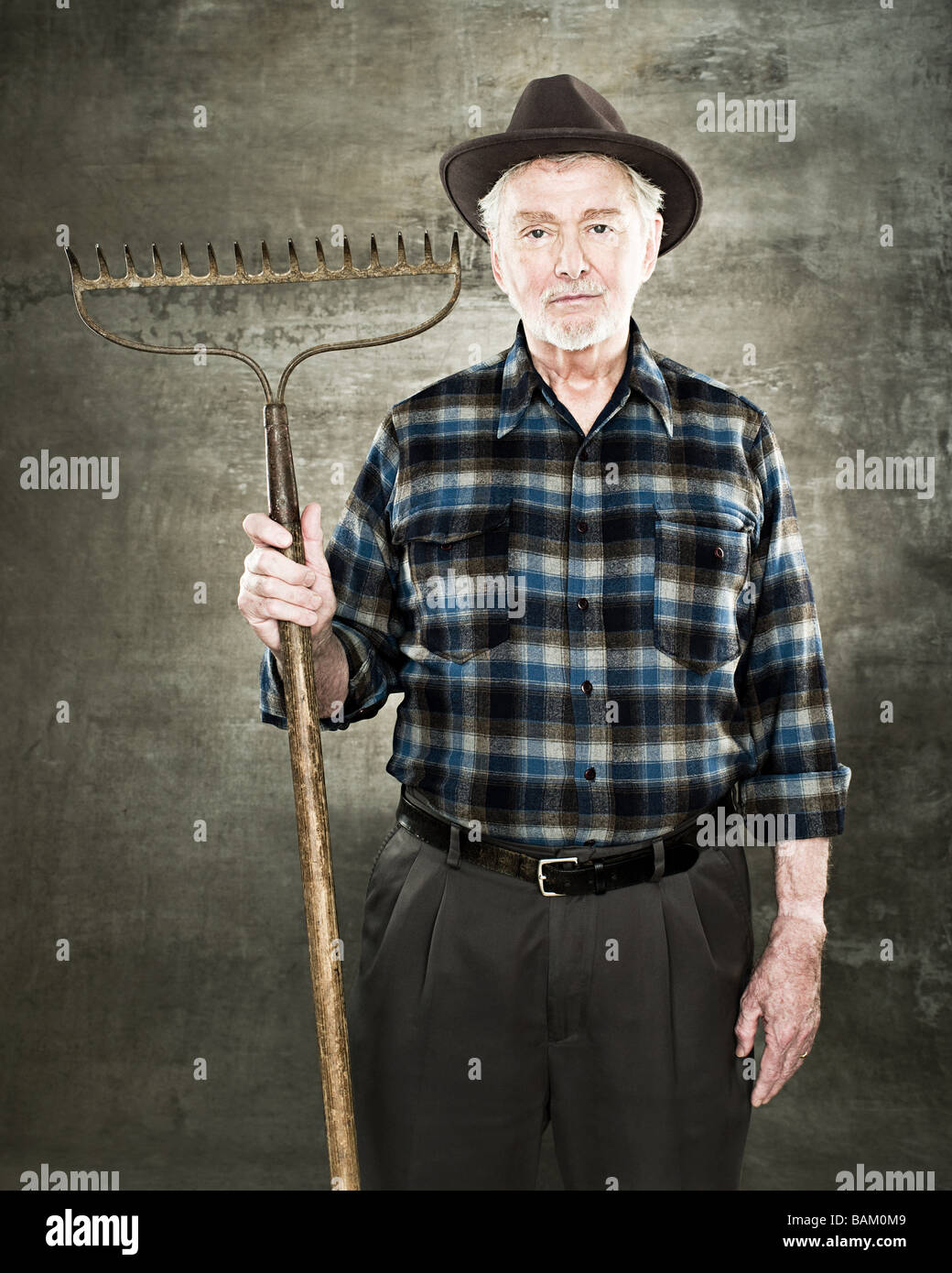 Portrait farmer holding rake hi-res stock photography and images - Alamy