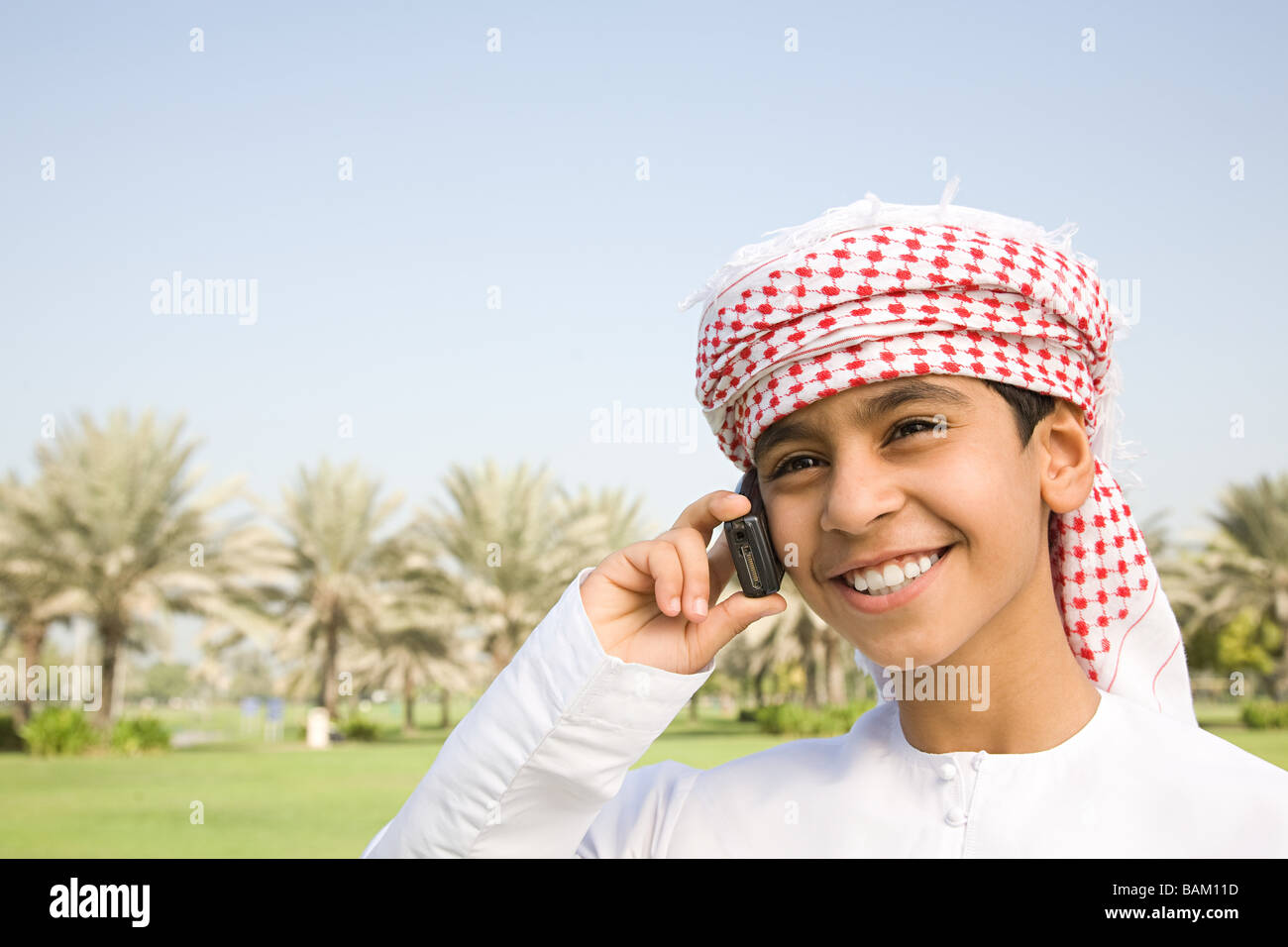 A boy using a cell phone Stock Photo