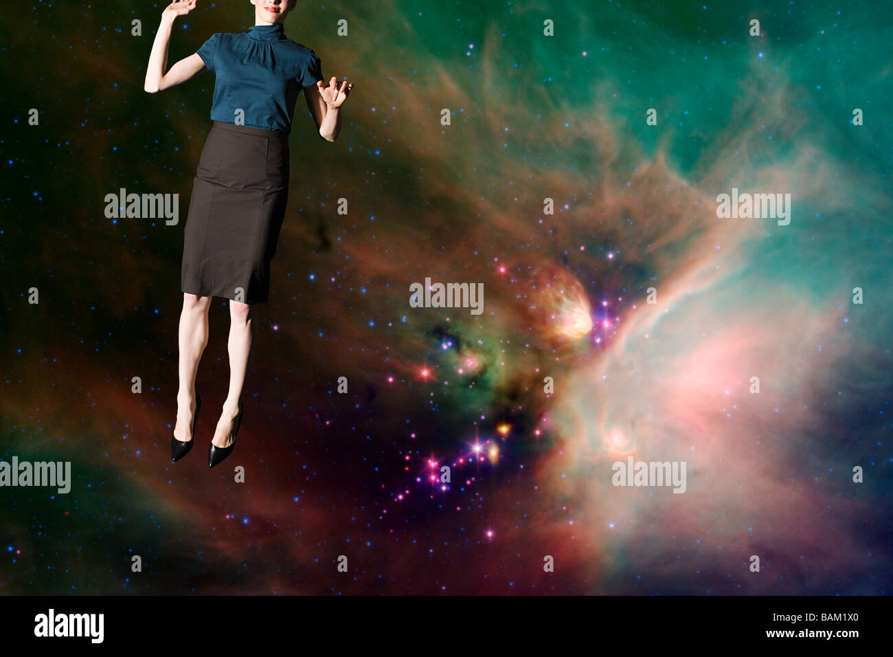 Businesswoman in outer space Stock Photo