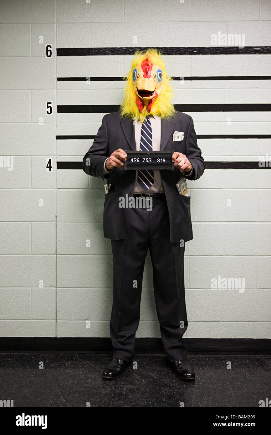 Mugshot of businessman with chicken head Stock Photo