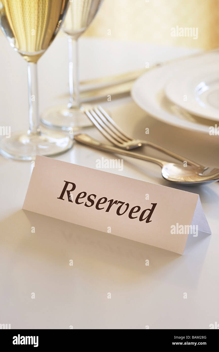 Reservation sign on a restaurant table Stock Photo
