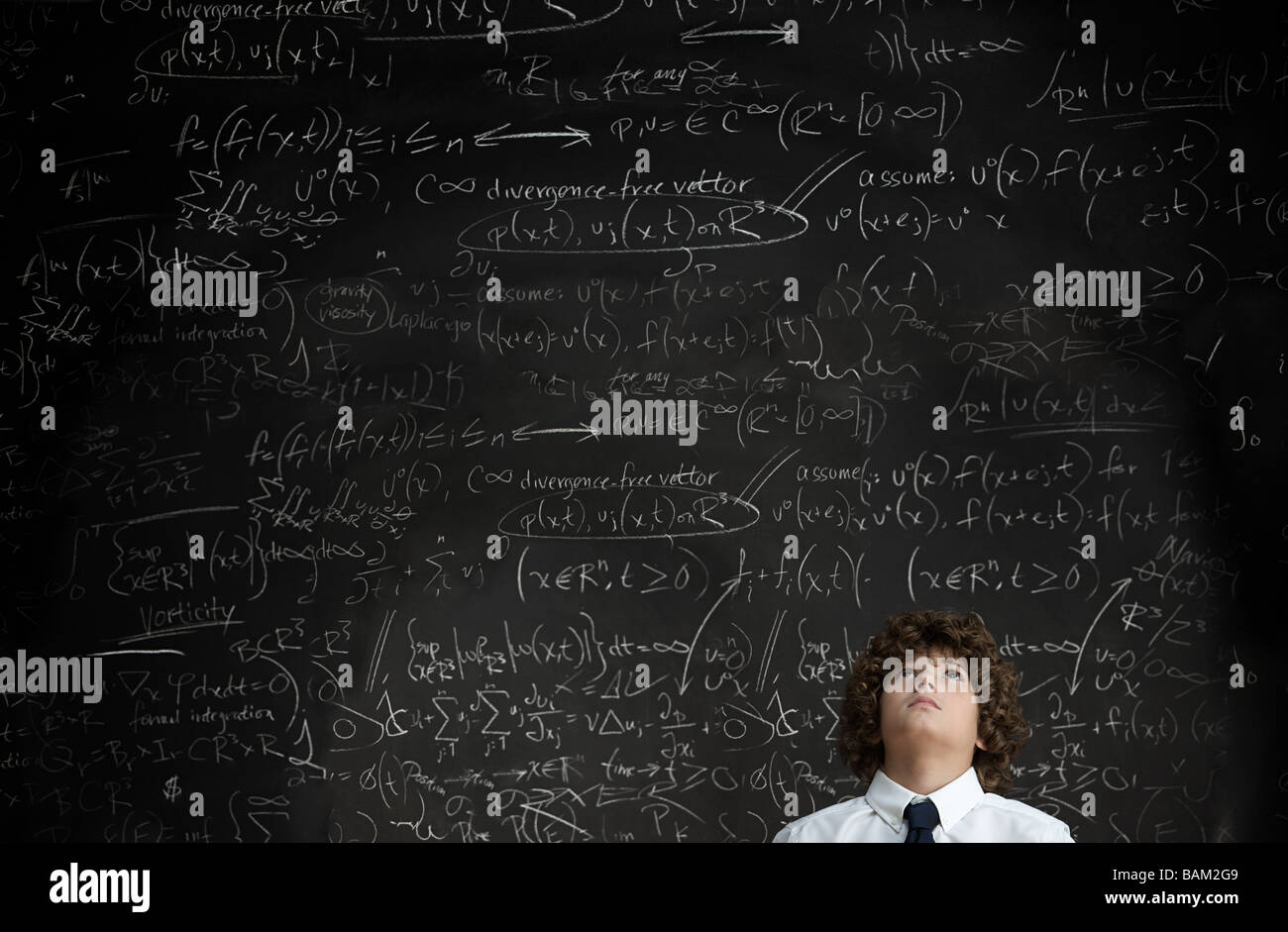 Boy in front of blackboard Stock Photo