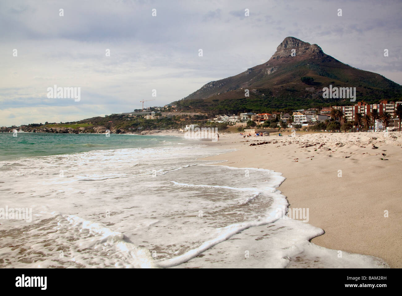 View along surf and beach to mountain at Camps Bay, Cape Town, South Africa Stock Photo