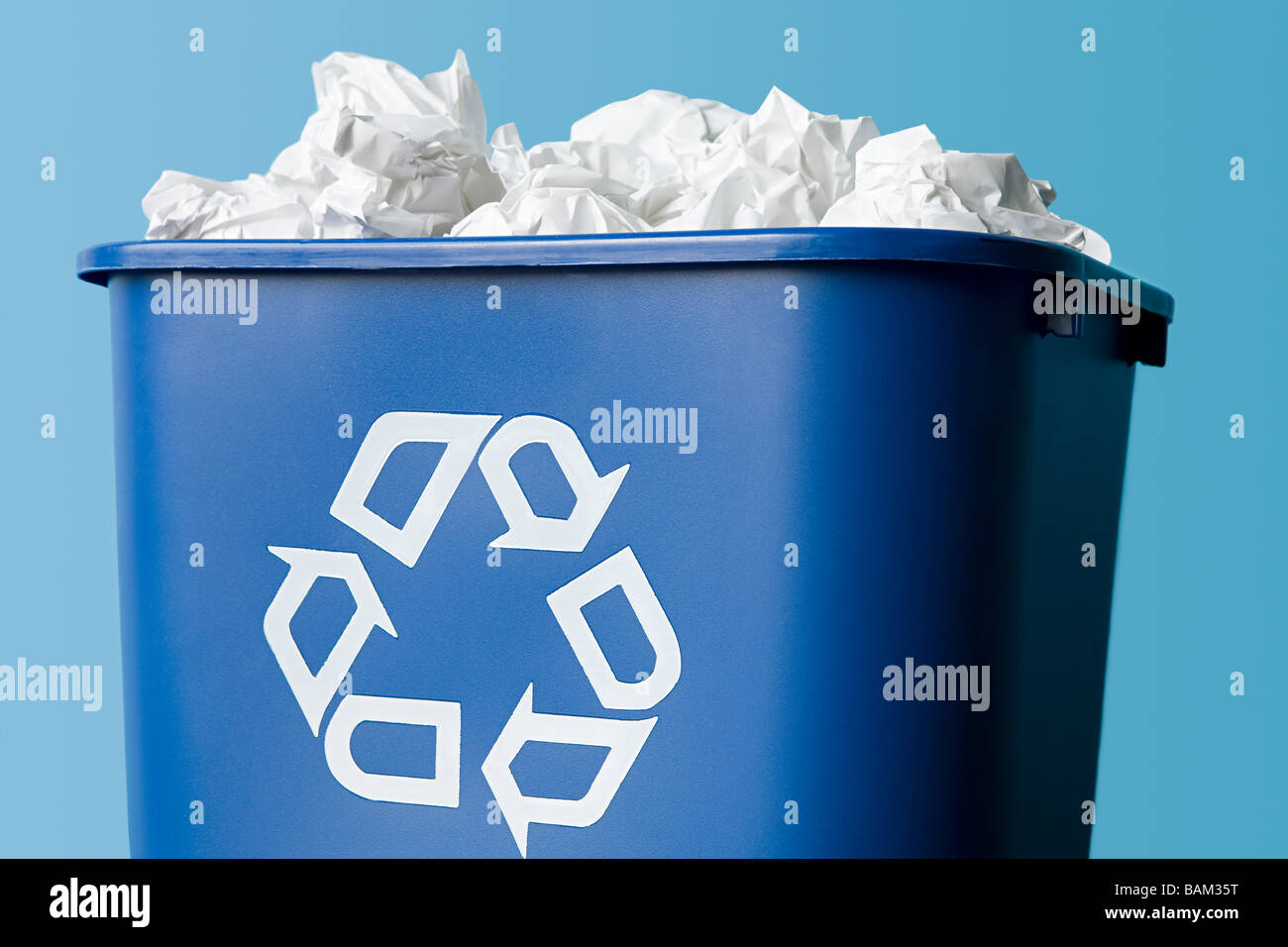 Paper in a recycling bin Stock Photo