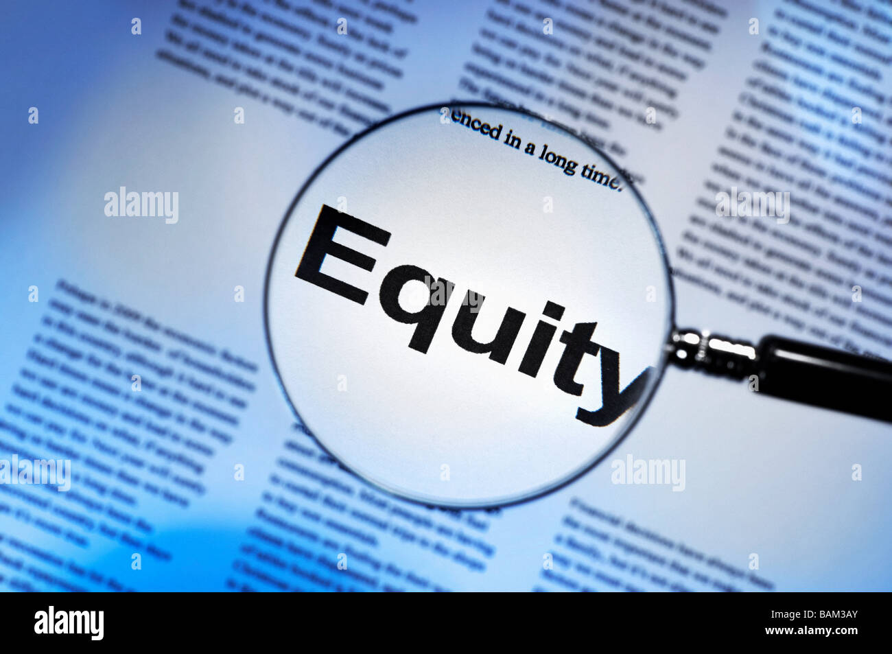 Word equity under magnifying glass Stock Photo