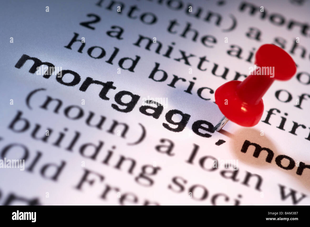 Thumb tack on word mortgage Stock Photo Alamy