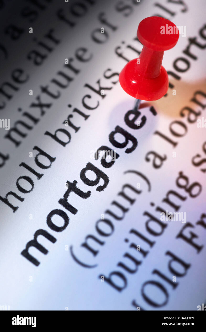 Thumb tack on word mortgage Stock Photo