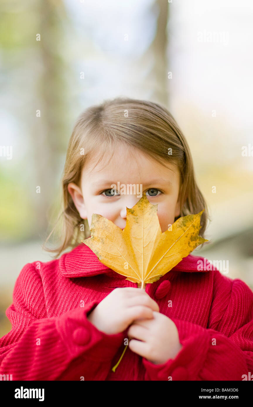 Girl holding a leaf Stock Photo - Alamy
