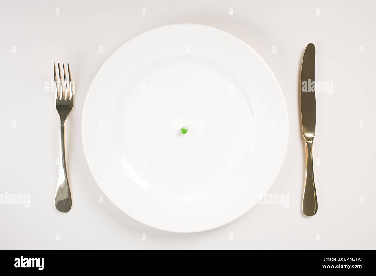 A pea on a plate Stock Photo