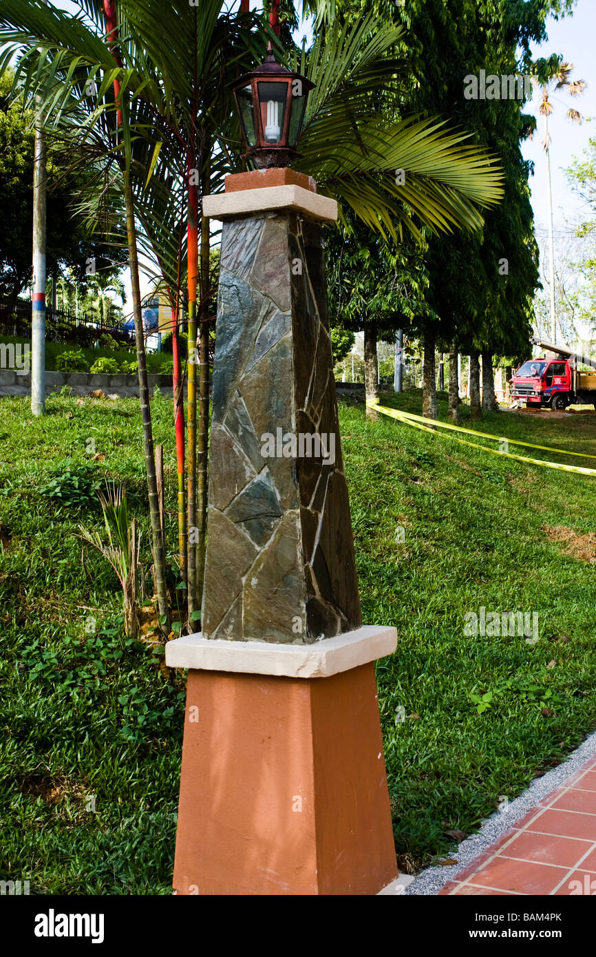 A low power compact fluorescent light in an outdoor light fitting Stock