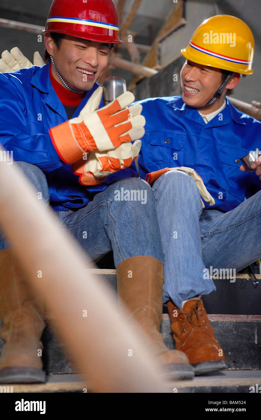 Men In Construction Site Wearing Hard Hats Stock Photo Alamy
