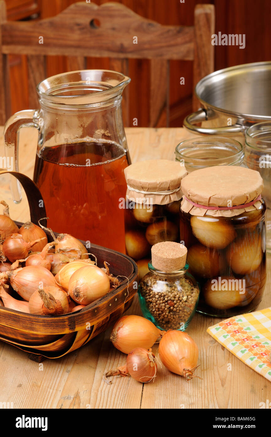 Country kitchen scene with home made jars of pickled onions Stock Photo