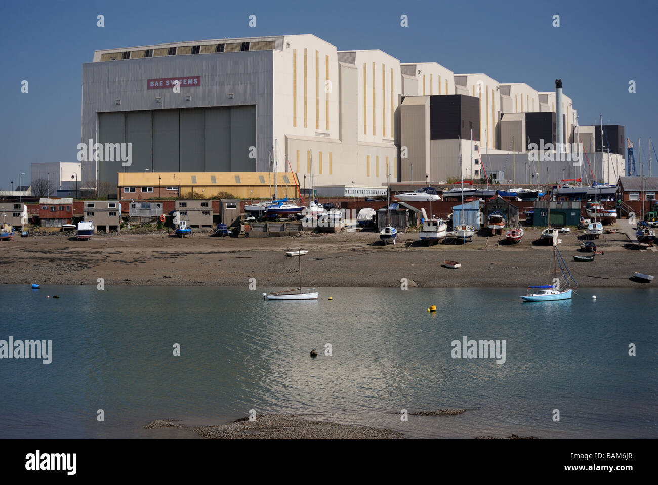 Walney Channel and BAE Systems Submarine Solutions buildings. Barrow-in-Furness, Cumbria, England, United Kingdom, Europe. Stock Photo