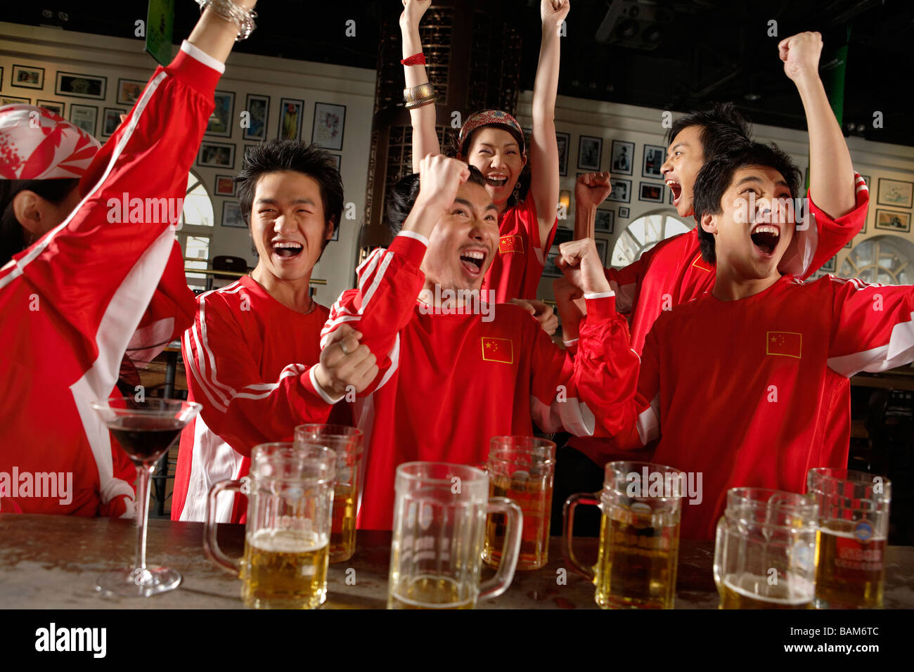 Sport Enthusiasts Celebrating Win In Bar Stock Photo Alamy