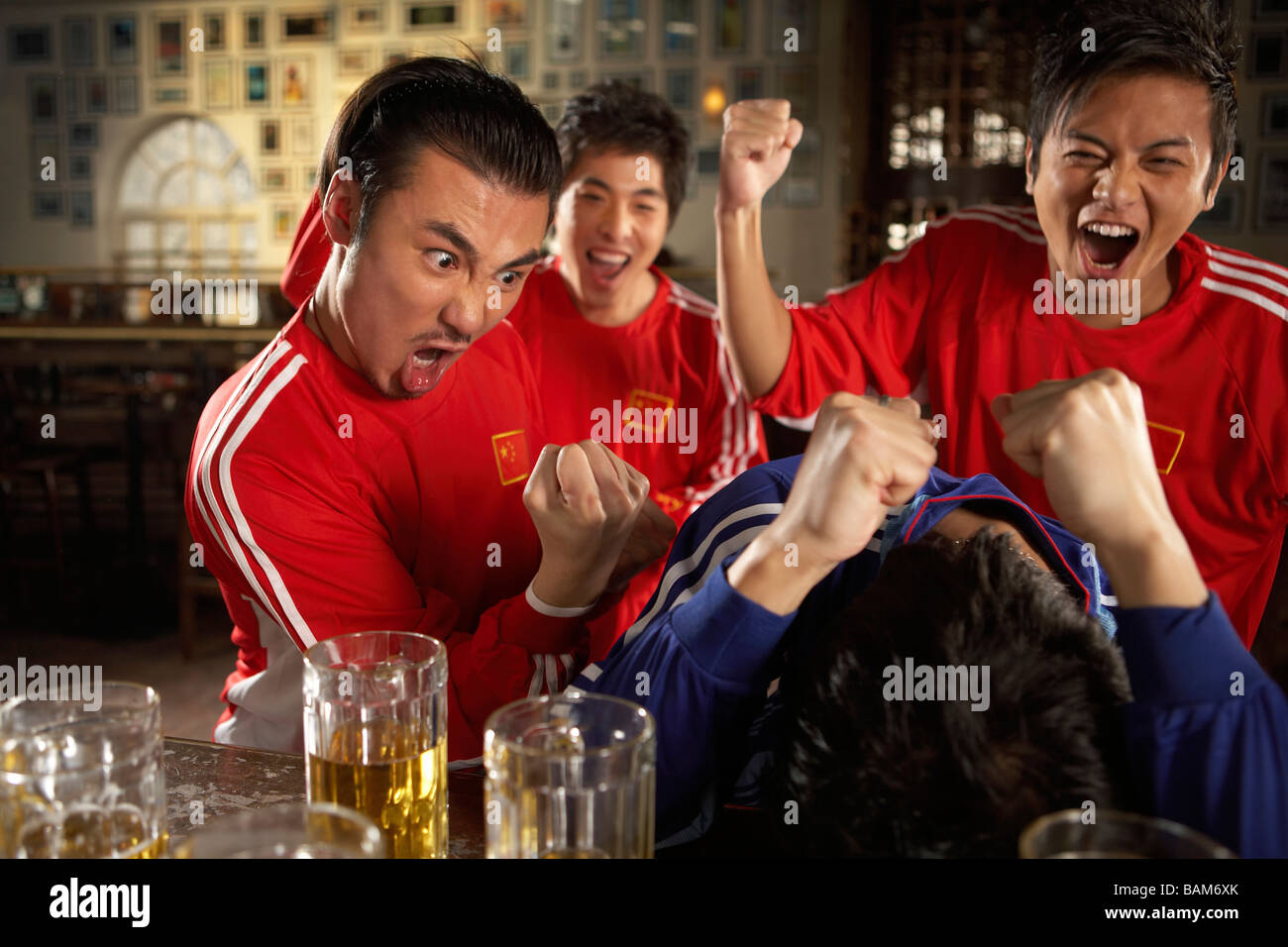 Sports Enthusiasts Competing In Bar Stock Photo Alamy