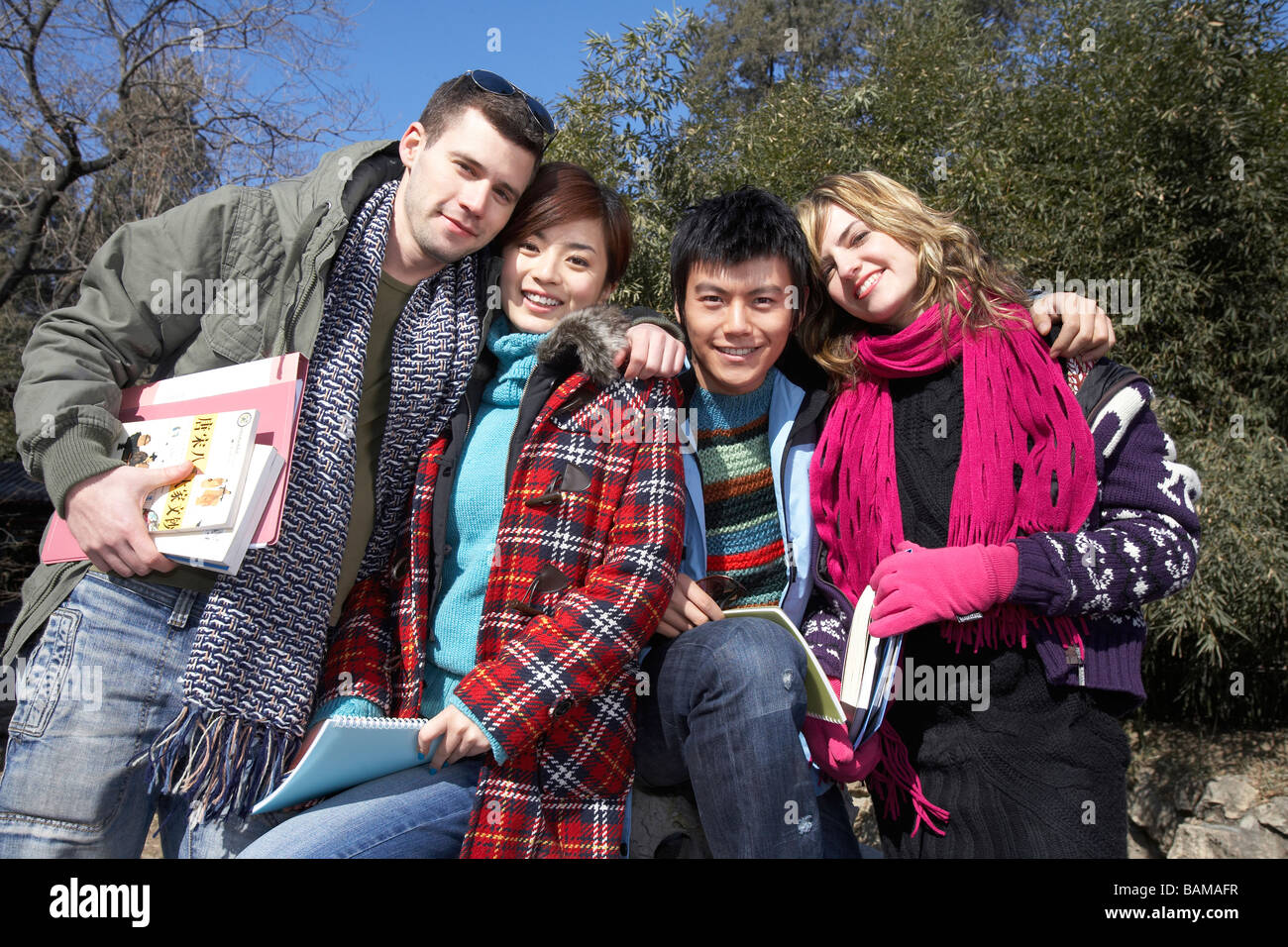 Young People With Arms Around Each Other Stock Photo - Alamy