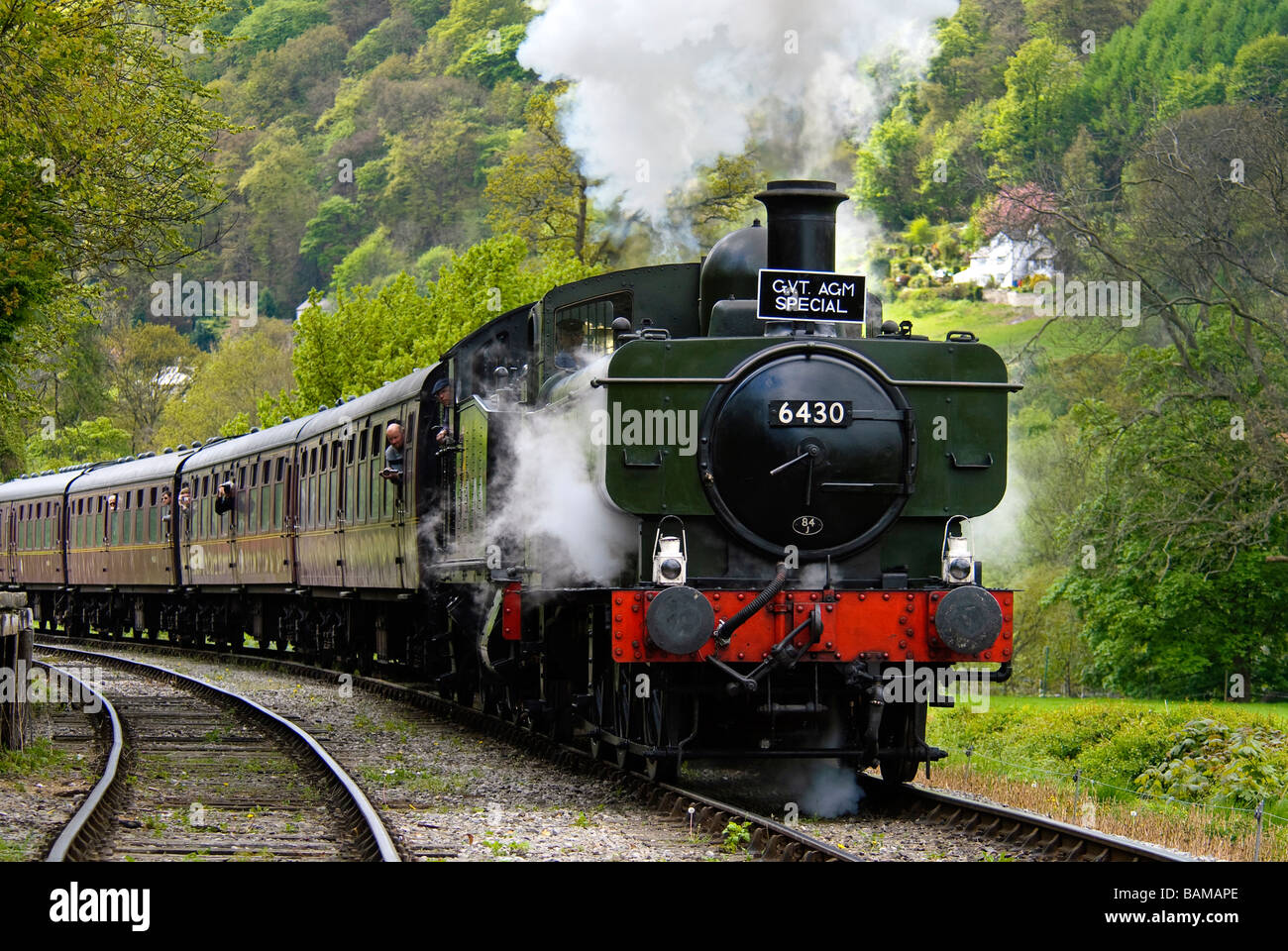 Double headed tank engines led by ex GWR tank 0-6-0PT No. 6430 haul out of Llangollen station. Stock Photo