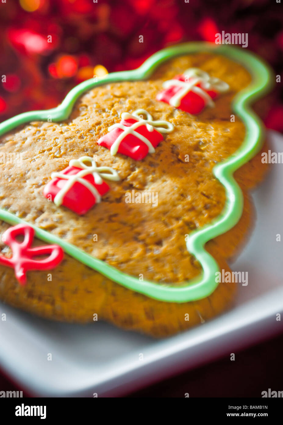 Warm-coloured close up of Christmas gingerbread biscuit, with soft focus and blur Stock Photo