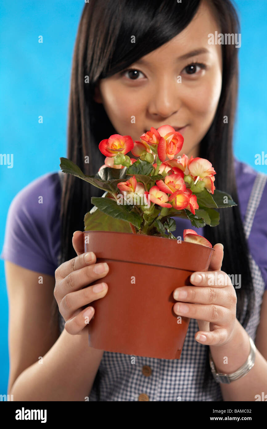 Young Woman Smelling A Flower Stock Photo - Alamy