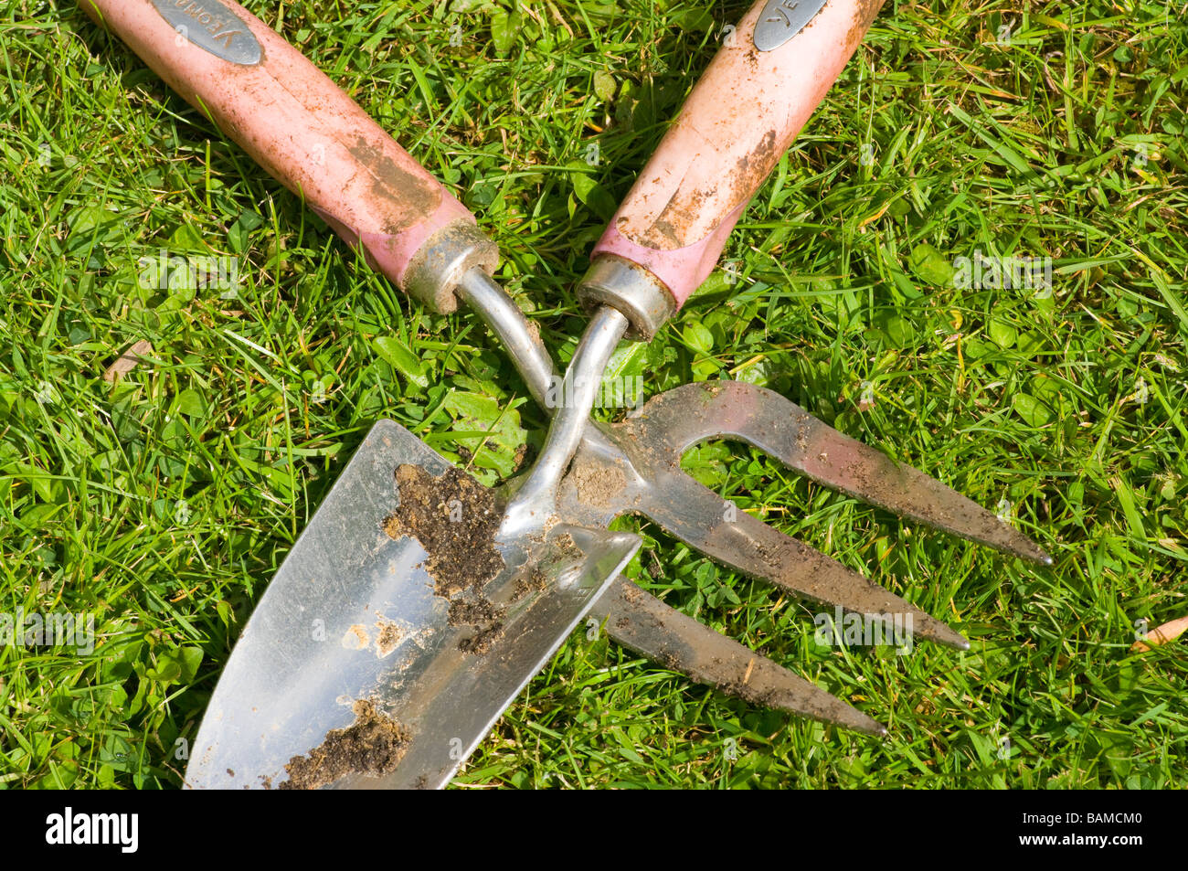 Gardening garden tools Hand Trowel and Fork Laying On The Grass Stock Photo Alamy