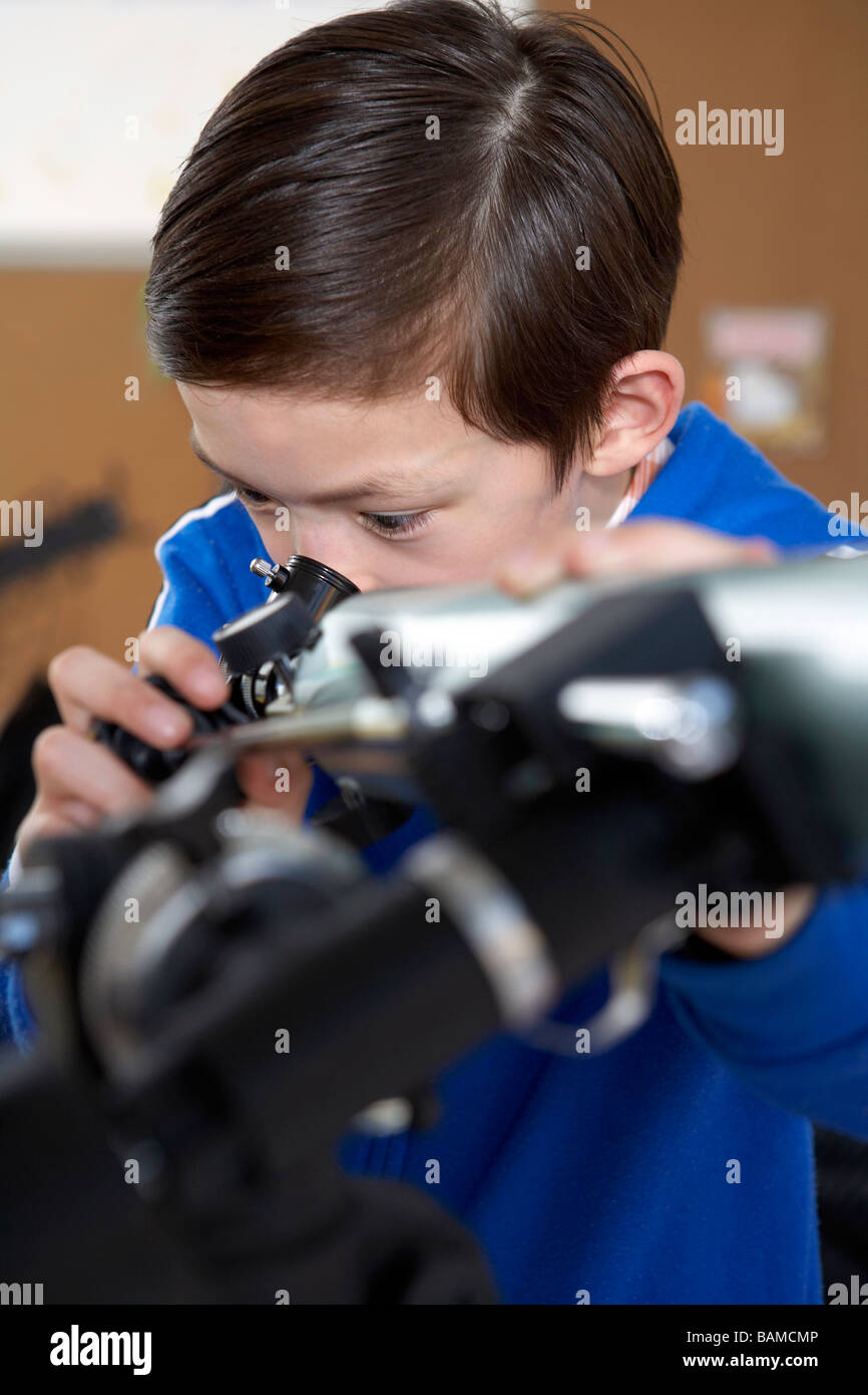 Boy Looking Through Telescope Stock Photo - Alamy