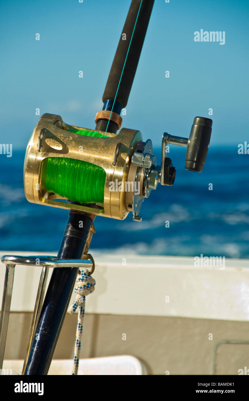 Big game fishing rod with reels on fishing boat Mauritius  Hochsee Angel  mit Rolle und Köder auf Angelboot Mauritius Stock Photo - Alamy