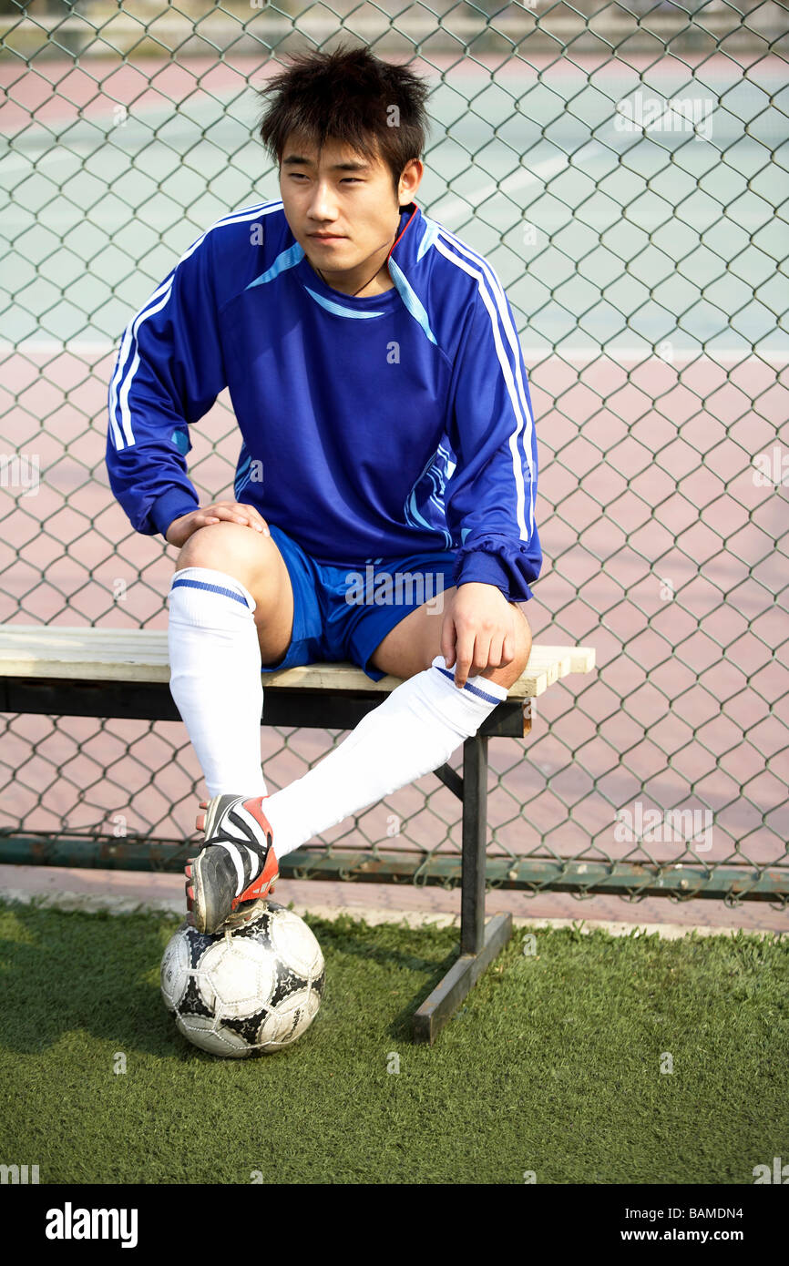 Young Soccer Player Sitting On Bench Stock Photo 23806752 Alamy
