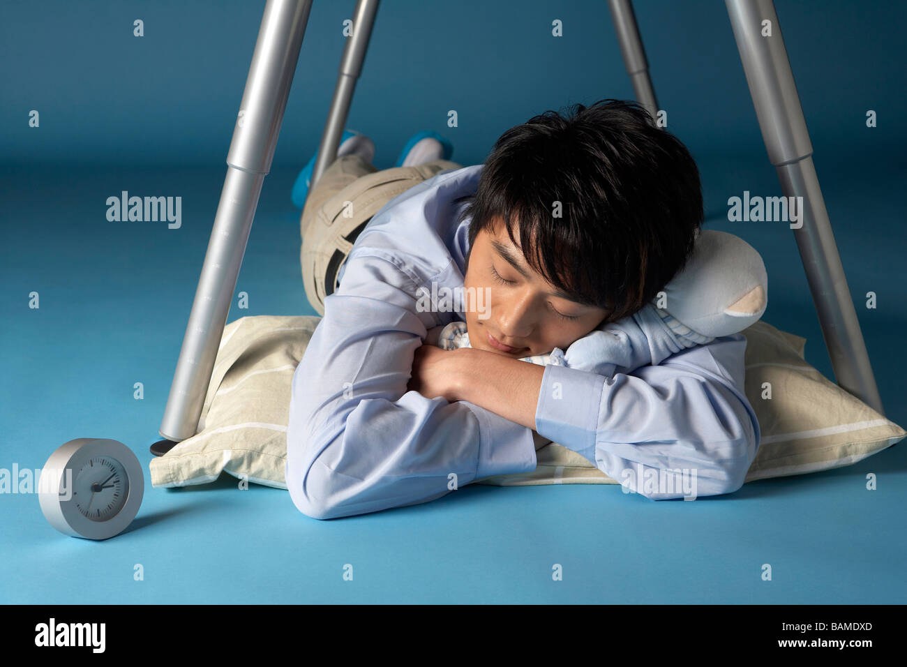 Man Sleeping Under His Desk Stock Photo Alamy