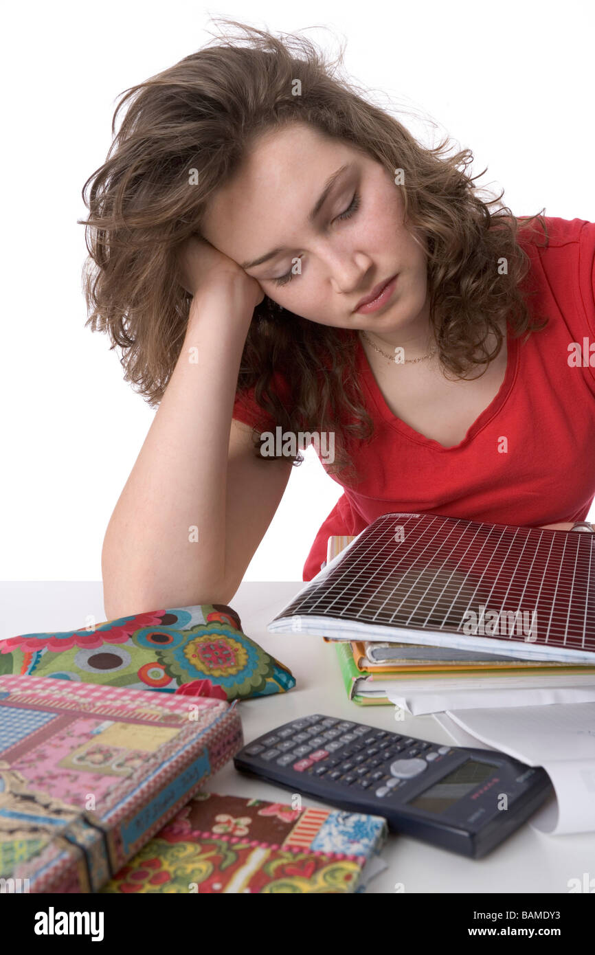 Teenage girl sleeping on her schoolbooks Stock Photo