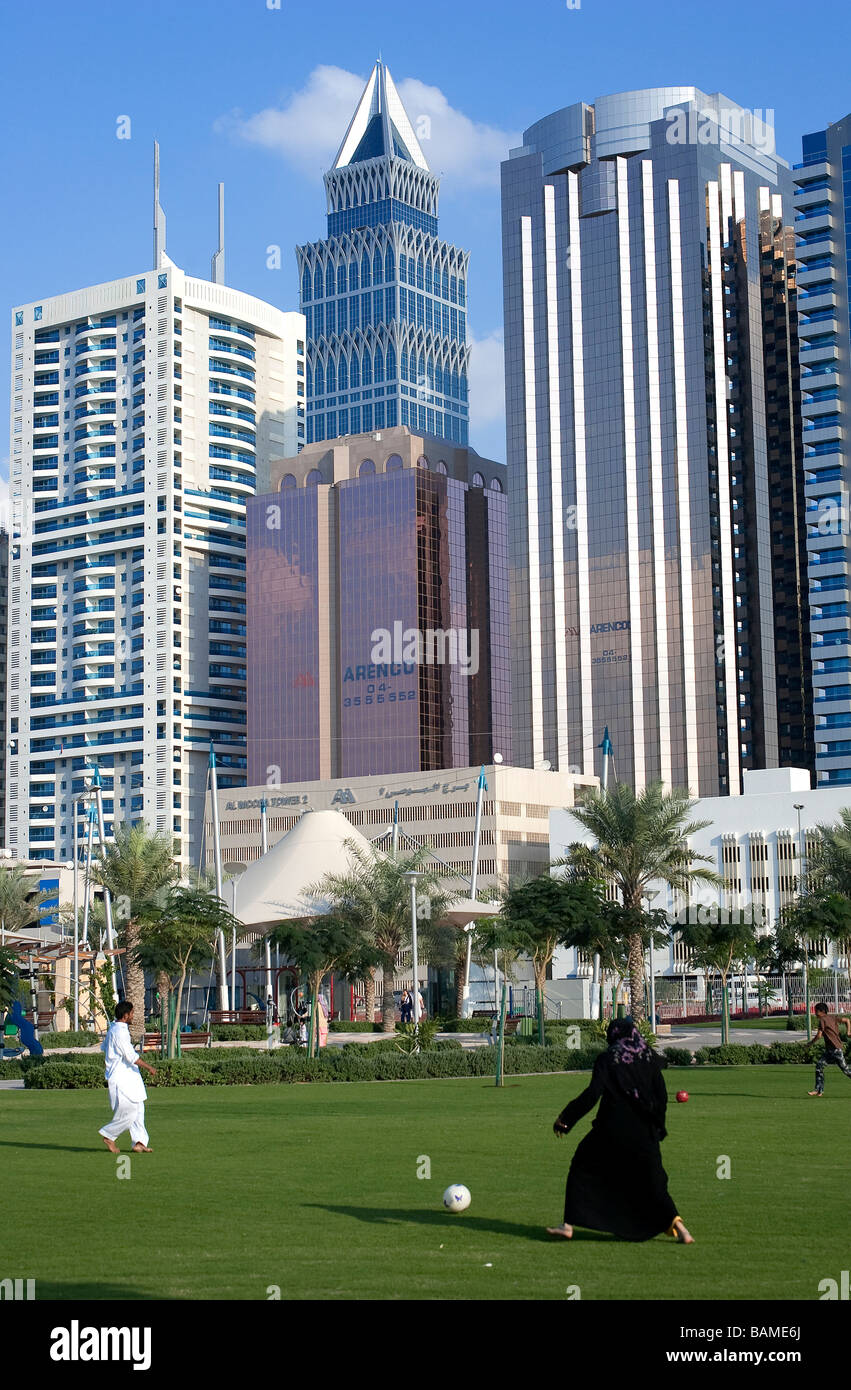 United Arab Emirates, Dubai, the rare case of a woman playing football with the towers of Sheikh