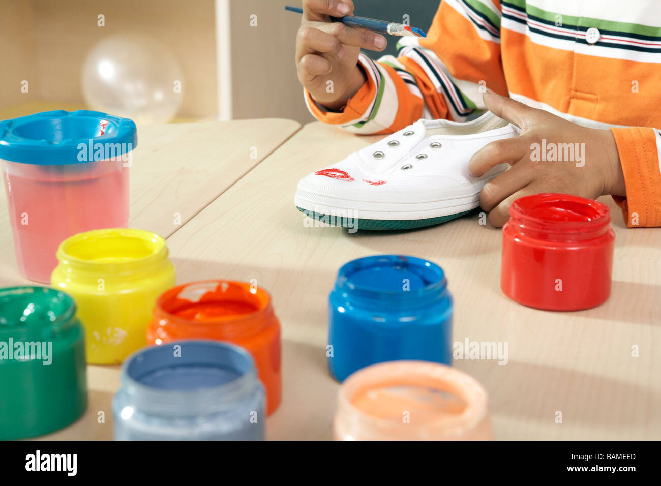 Boy Painting Shoe Stock Photo Alamy